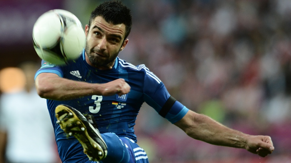 Greek defender Giorgos Tzavellas shots t